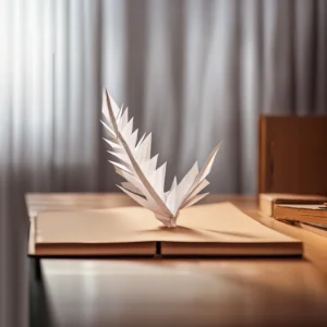 Plume origami blanche pos&eacute;e sur un livre ouvert.